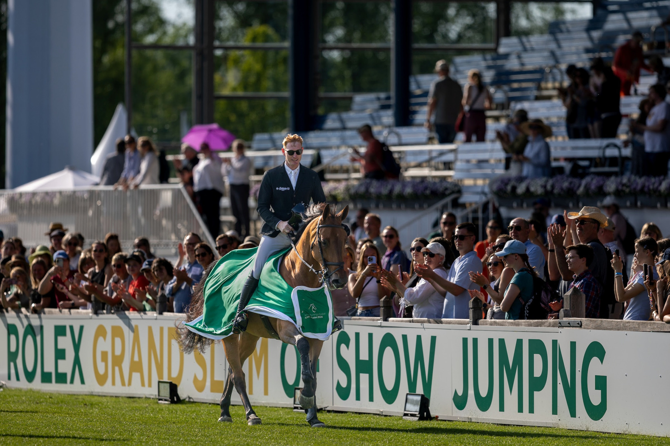 ©Rolex Grand Slam Ashley Neuhof Daniel Coyle riding Farrel TSCHIO 2026